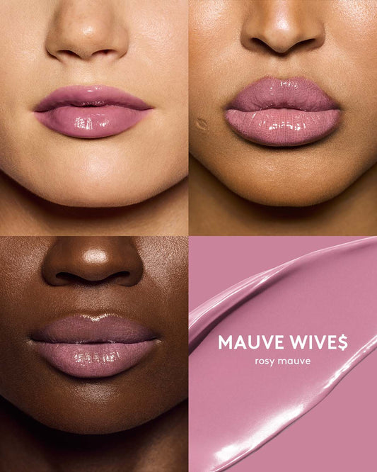 three different skin toned models wearing gloss bomb color drip lip cream in shade mauve wive$