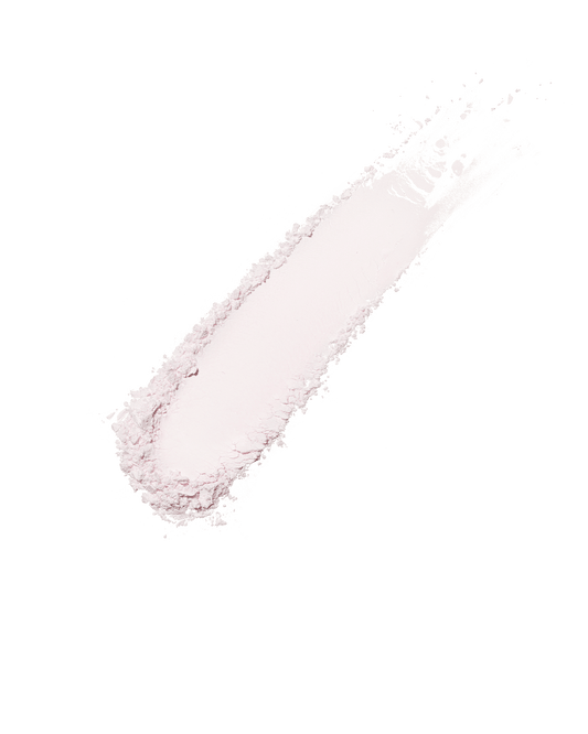 A smear of the Invisimatte Instant Setting Blotting Powder on a light background.