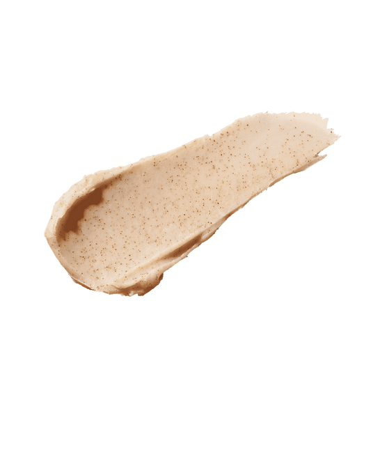 Smear of the Pro Kiss'r Lip-Loving Scrubstick on a white background, showcasing its thick consistency and fine sandy texture.
