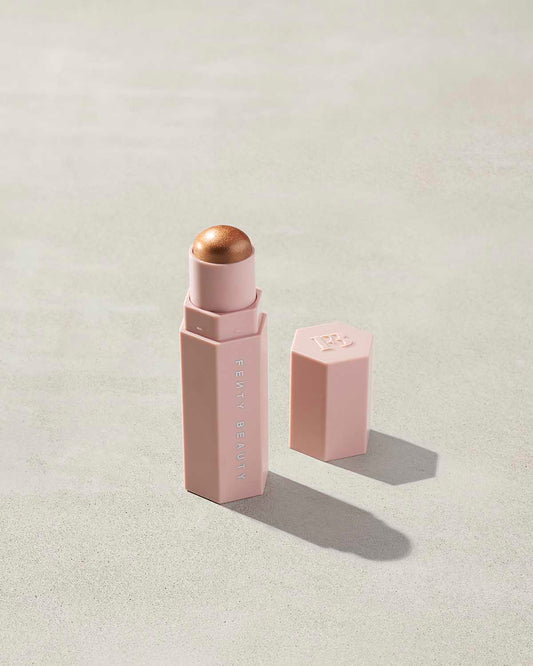 Match Stix Shimmer Skinstick shown in shade Crown’d on a concrete background.