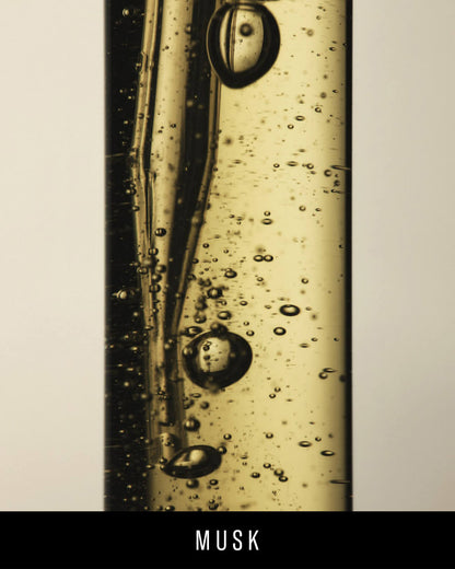 A closeup of the Fenty Eau de Parfum liquid comprising of bubbles in various sizes.