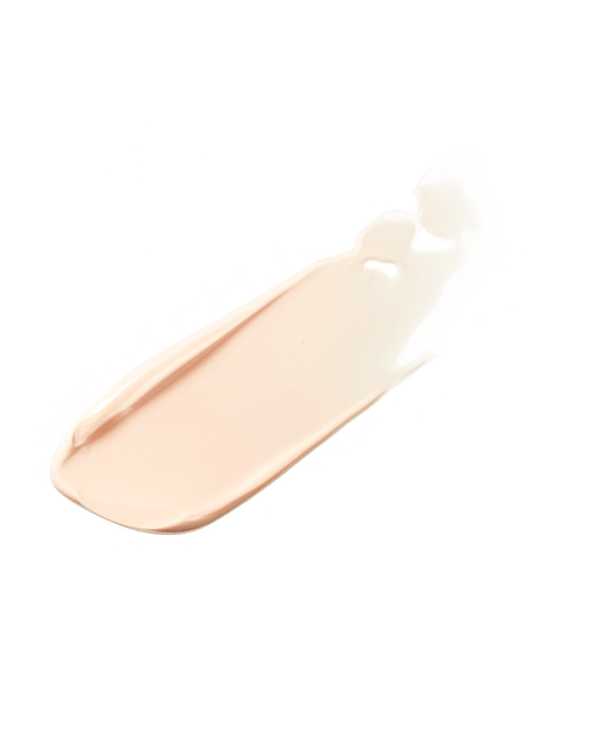 A tan smear of instant retouch primer on a white background